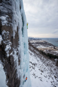 Two climbers doing ice climbing in Bodo, Nordland, Norway Two climbers doing ice climbing in Bodo, Nordland, Norway